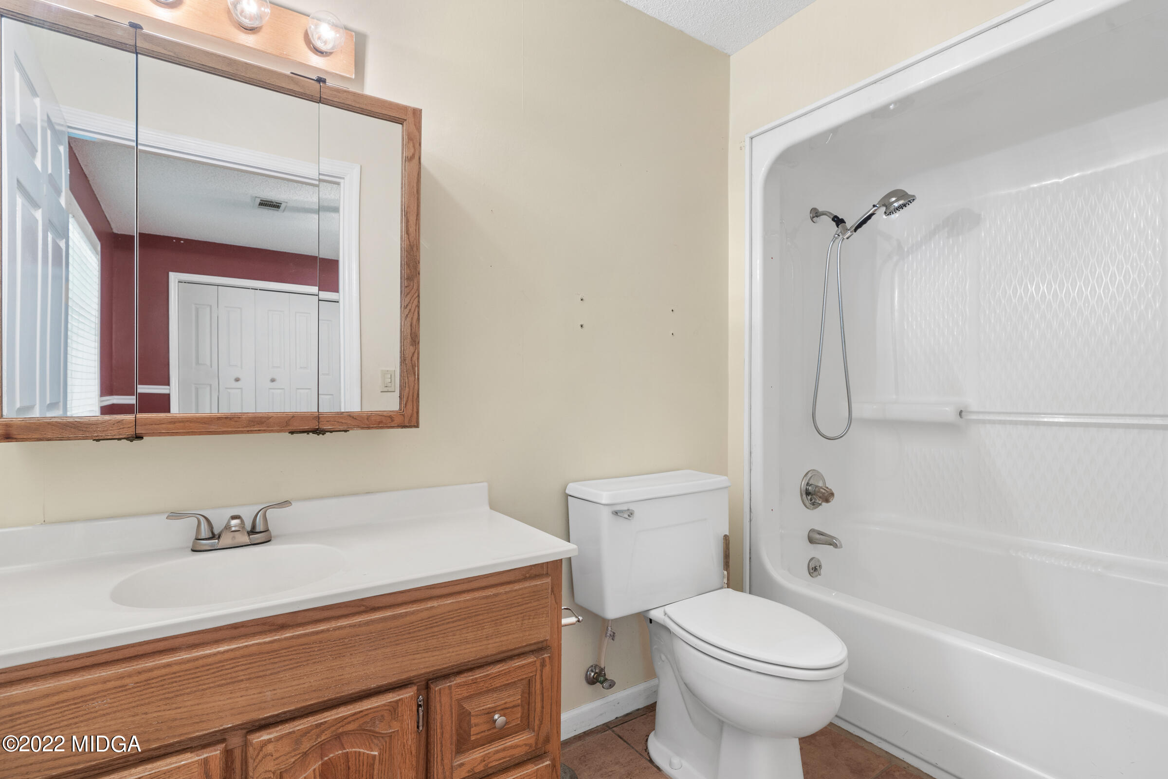 457 Lite-N-Tie Road Gray, GA 31032 - Photo 12 of 30 a bathroom with a sink toilet vanity and shower