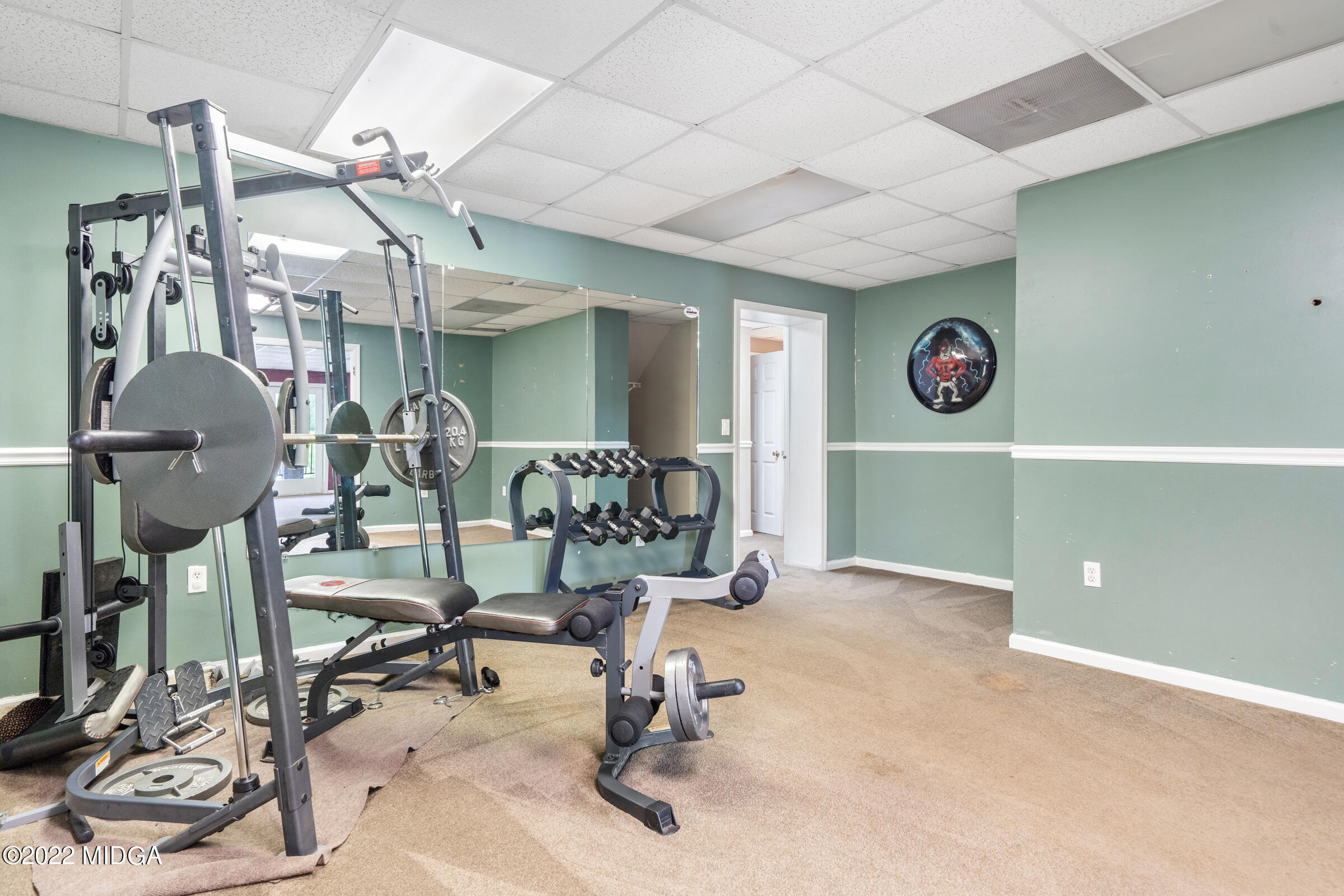 457 Lite-N-Tie Road Gray, GA 31032 - Photo 20 of 30 a view of a room with gym equipment