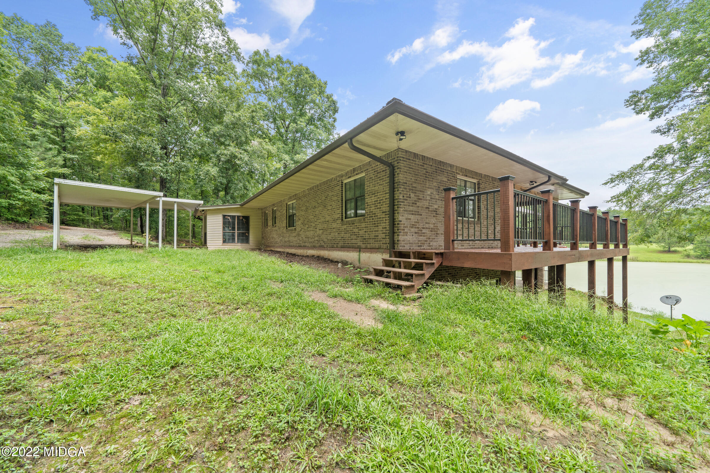 457 Lite-N-Tie Road Gray, GA 31032 - Photo 22 of 30 a view of a house with a yard