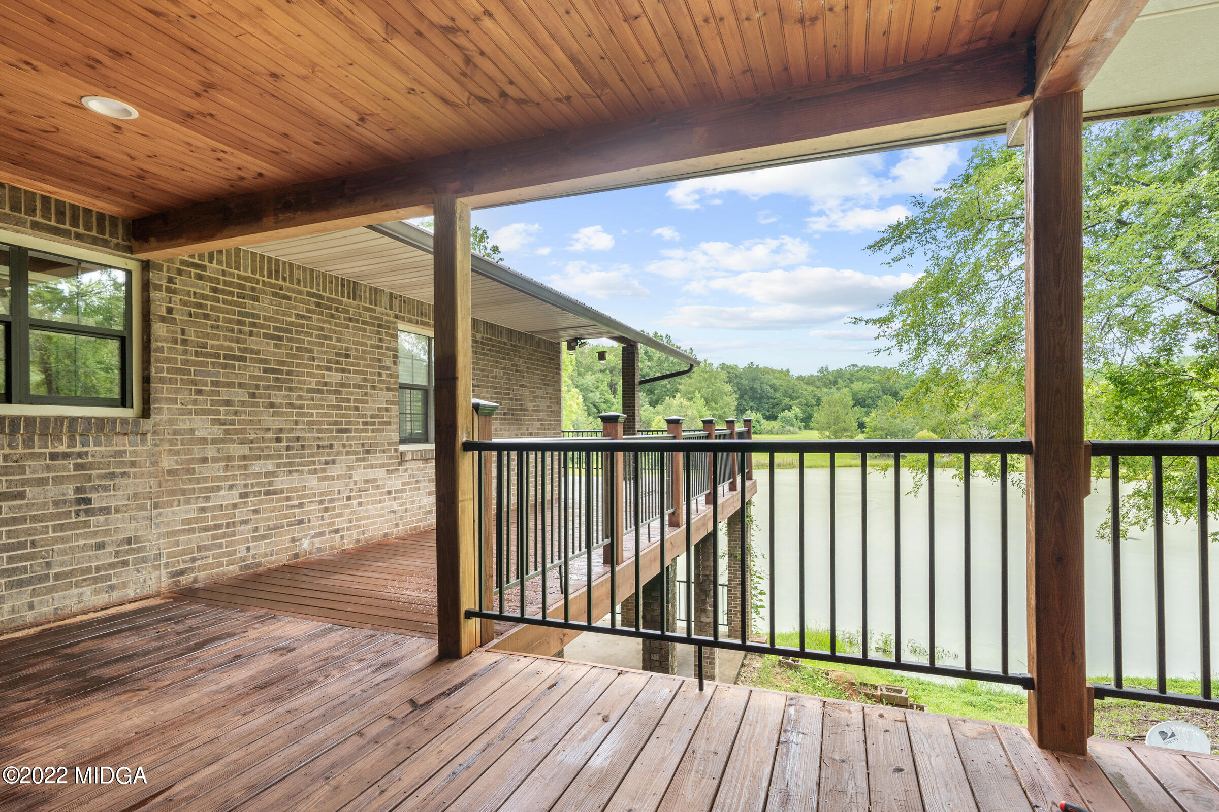 457 Lite-N-Tie Road Gray, GA 31032 - Photo 23 of 30 a view of a balcony with wooden floor