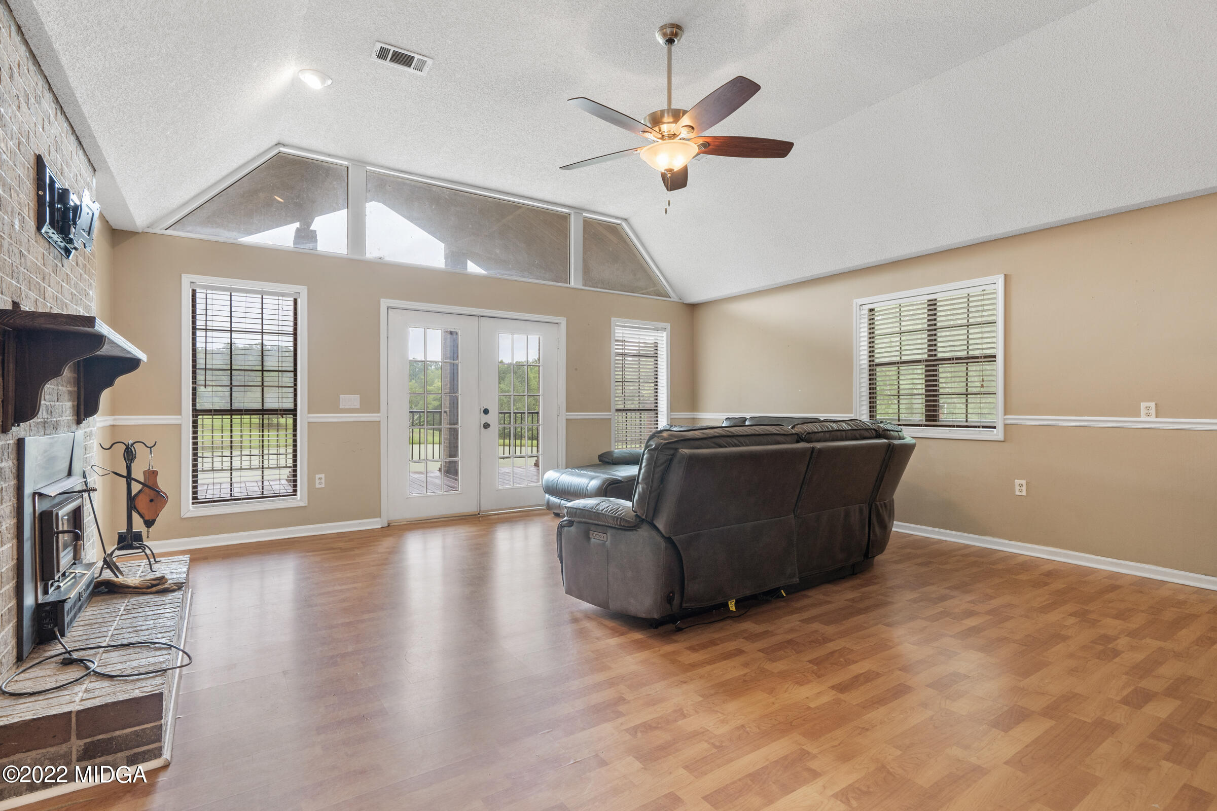 457 Lite-N-Tie Road Gray, GA 31032 - Photo 8 of 30 a living room with furniture and a large window
