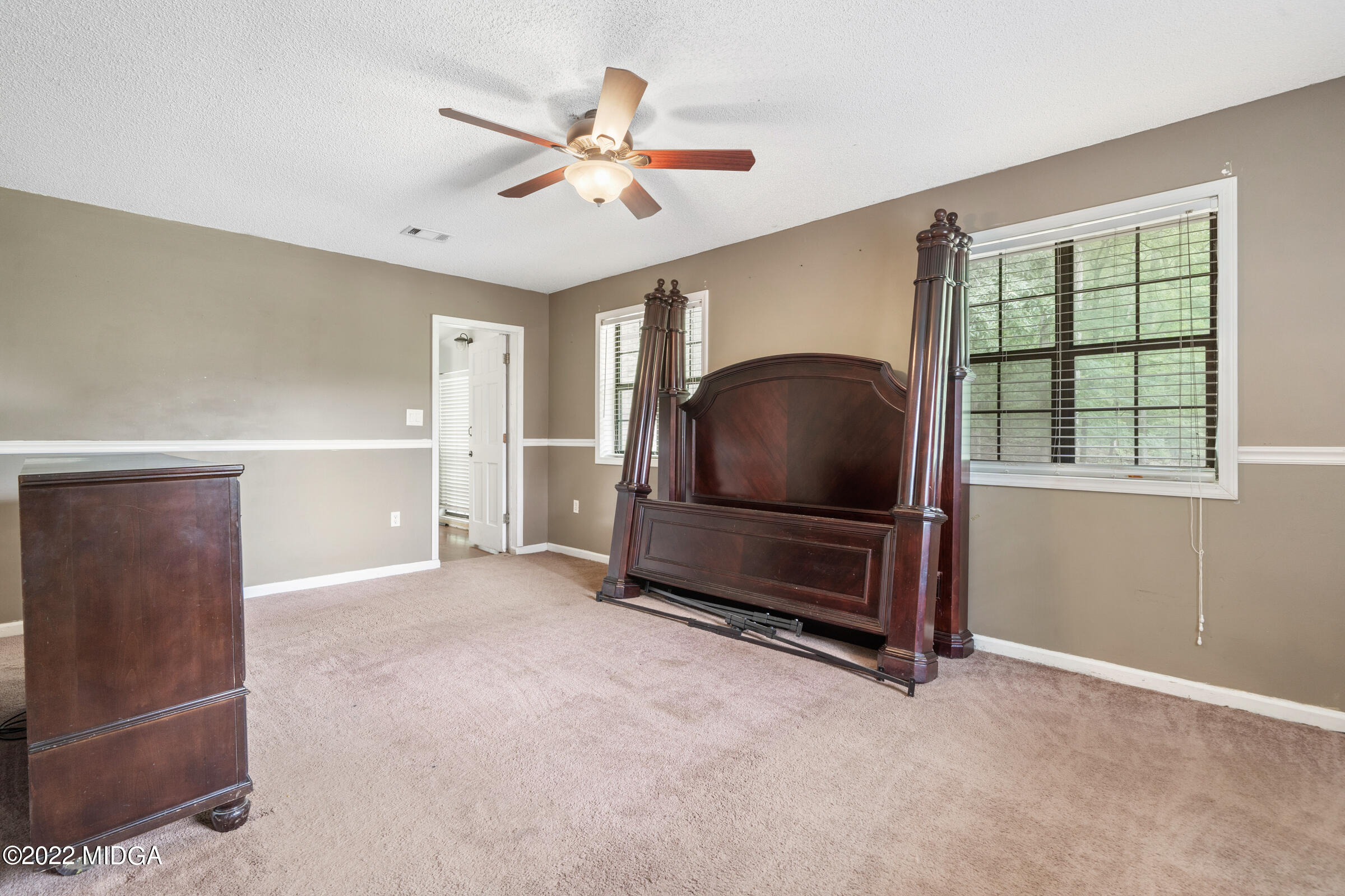 457 Lite-N-Tie Road Gray, GA 31032 - Photo 9 of 30 a living room with a flat screen tv and windows