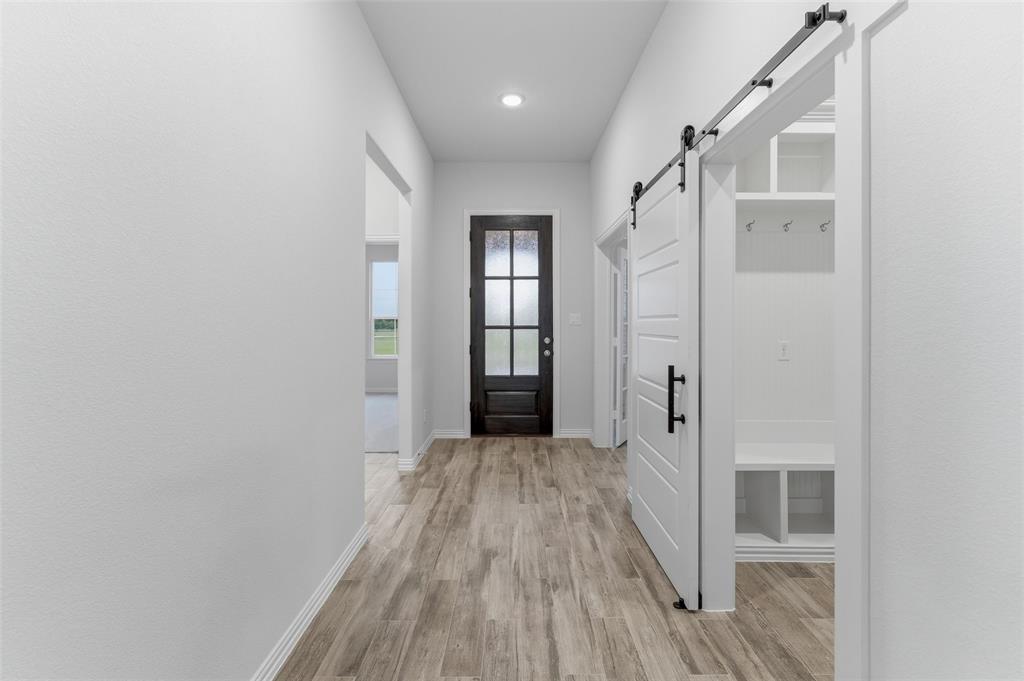119 Hillview Trail Decatur, TX 76234 - Photo 10 of 30 Entryway featuring wood-finish flooring, a dark-paneled door with frosted glass, and recessed lighting