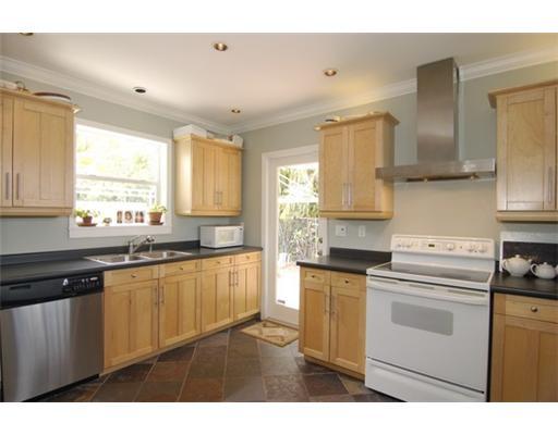 320 Potter Road West Palm Beach, FL 33405 - Photo 4 of 11 a kitchen with granite countertop white cabinets and white appliances