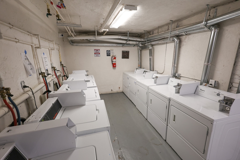 100 Seaver Street, Unit 2 Boston, MA 02121 - Photo 18 of 18 a utility room with multiple dryer and washer