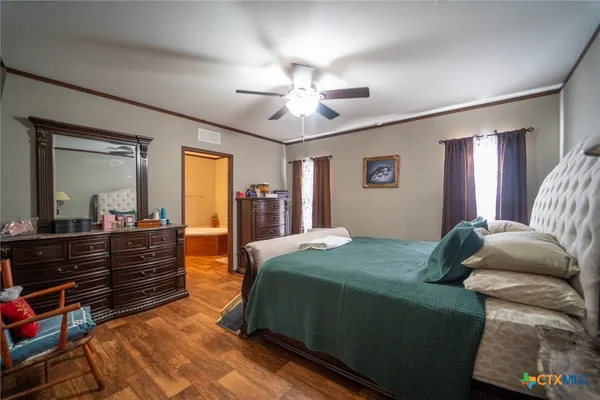 a bed room with a bed and a dresser