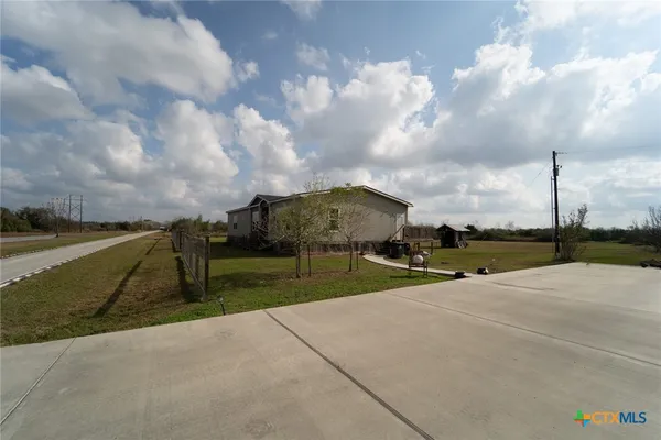 a view of a playground with basketball court