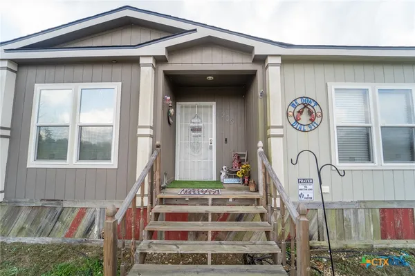 a front view of a house with entryway