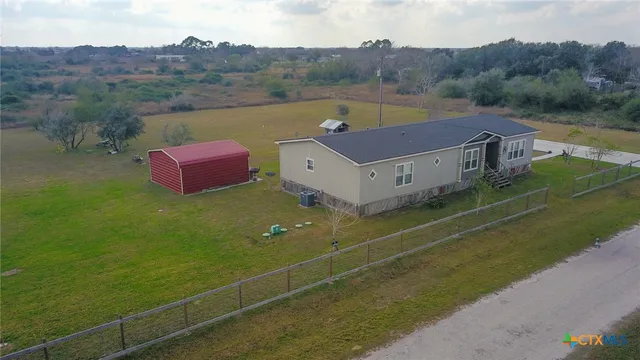 a view of a field with an ocean