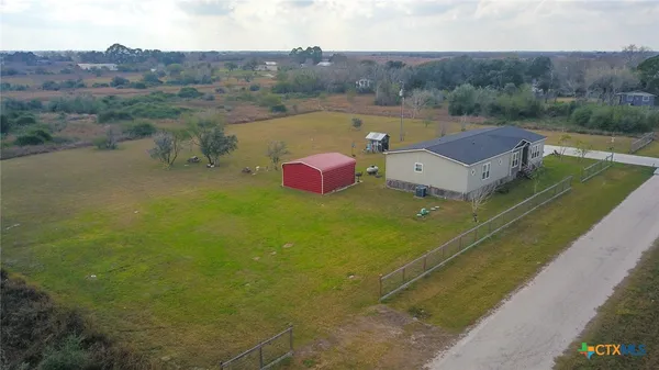 a view of a lake with a yard