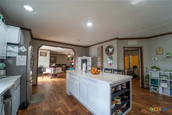 a view of living room with furniture and wooden floor