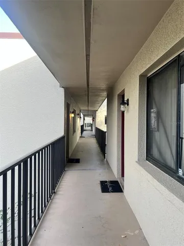 a view of hallway with a couch