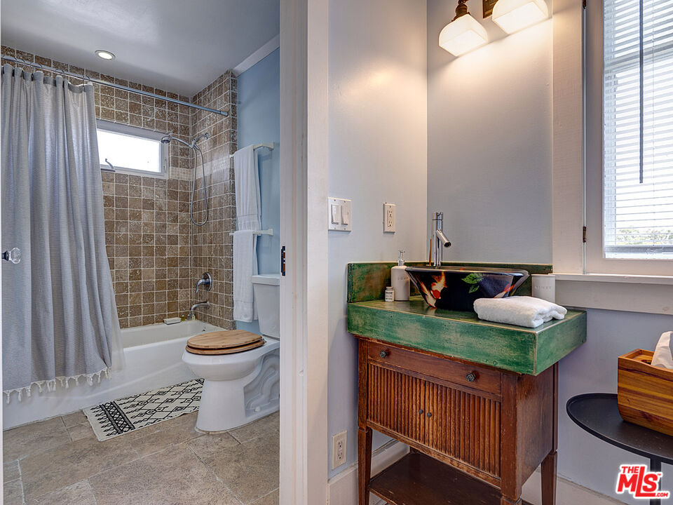 111 Dudley Avenue Venice, CA 90291 - Photo 26 of 33 a bathroom with sink mirror and toilet