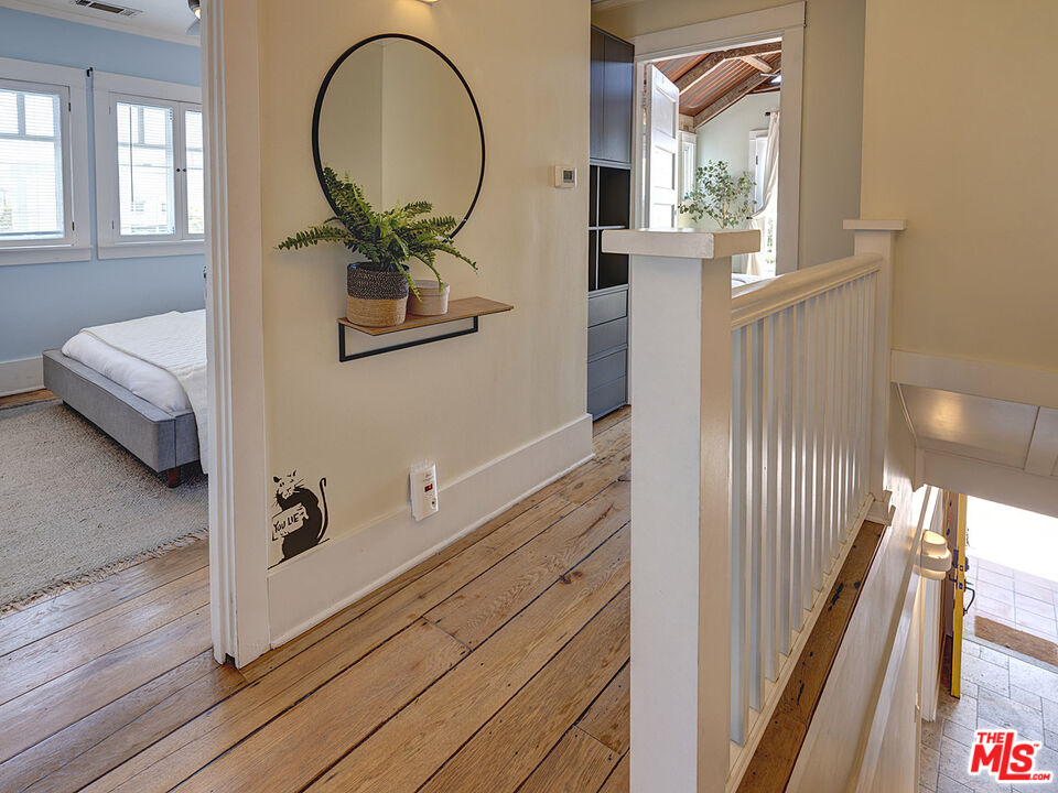 111 Dudley Avenue Venice, CA 90291 - Photo 27 of 33 a view of a hallway with wooden floor and glass windows