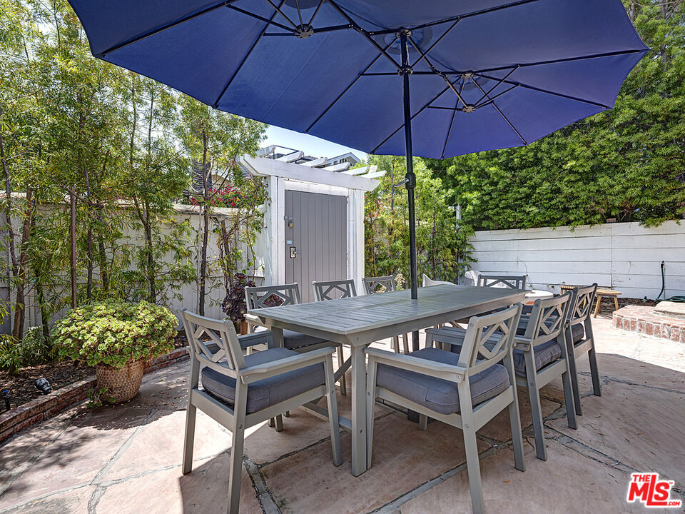 111 Dudley Avenue Venice, CA 90291 - Photo 4 of 33 a view of a patio with table and chairs under an umbrella