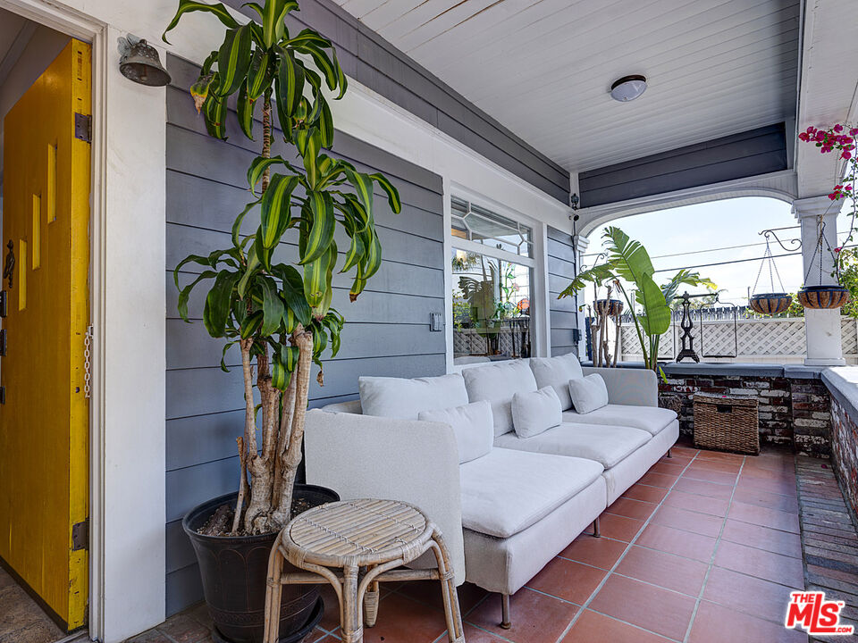 111 Dudley Avenue Venice, CA 90291 - Photo 6 of 33 a living room with furniture a potted plant and a large window