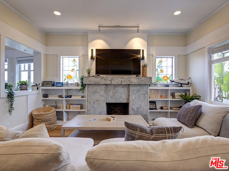 111 Dudley Avenue Venice, CA 90291 - Photo 9 of 33 a living room with furniture a flat screen tv and a fireplace