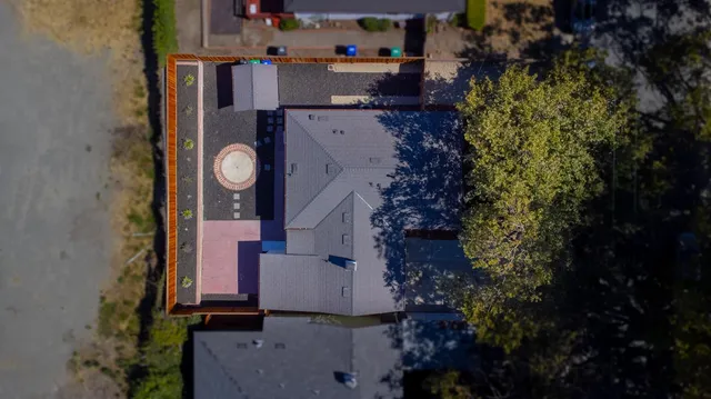 an aerial view of residential houses with outdoor space