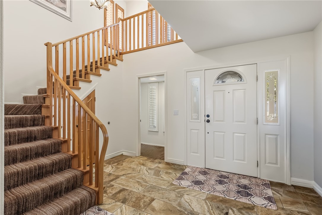 3342 Park Ridge Avenue Bullhead City, AZ 86429 - Photo 13 of 93 The property features a grand entryway with a hardwood staircase and a two-story foyer