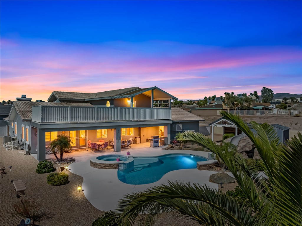 3342 Park Ridge Avenue Bullhead City, AZ 86429 - Photo 2 of 93 The property features an expansive outdoor area with a swimming pool and an integrated spa