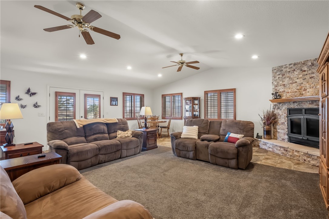3342 Park Ridge Avenue Bullhead City, AZ 86429 - Photo 31 of 93 Spacious living area featuring vaulted ceilings, recessed lighting, and ceiling fans