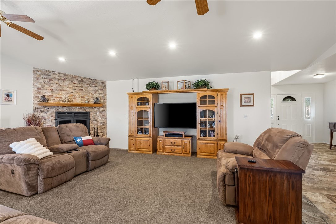 3342 Park Ridge Avenue Bullhead City, AZ 86429 - Photo 32 of 93 The living area features a brick accent wall with a fireplace and a wooden mantel