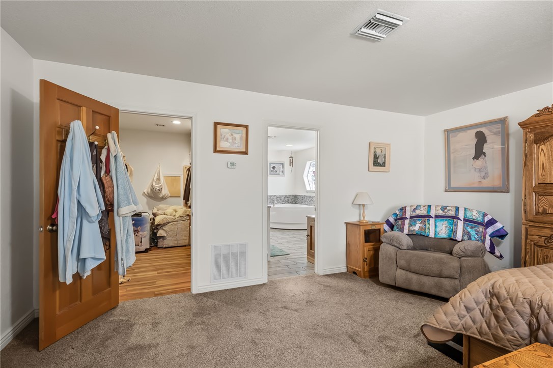3342 Park Ridge Avenue Bullhead City, AZ 86429 - Photo 50 of 93 Carpeted room with white walls and a wooden door