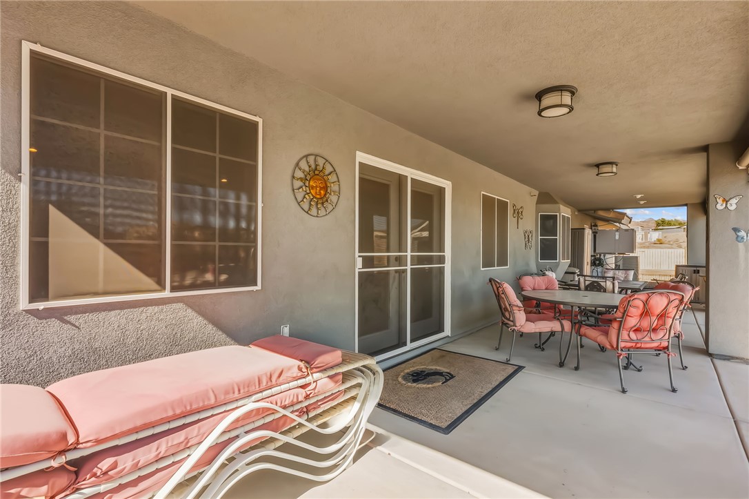 3342 Park Ridge Avenue Bullhead City, AZ 86429 - Photo 71 of 93 The property features a covered patio with a concrete floor and ceiling-mounted light fixtures
