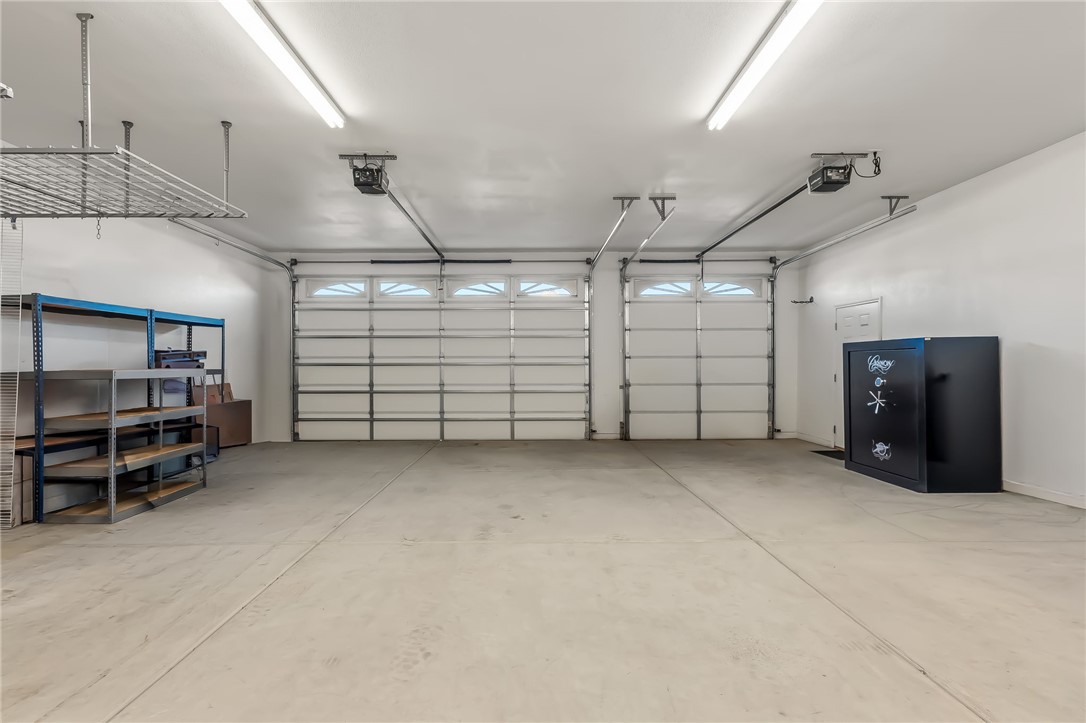 3342 Park Ridge Avenue Bullhead City, AZ 86429 - Photo 77 of 93 Detached garage featuring two garage doors, overhead lighting, and concrete flooring