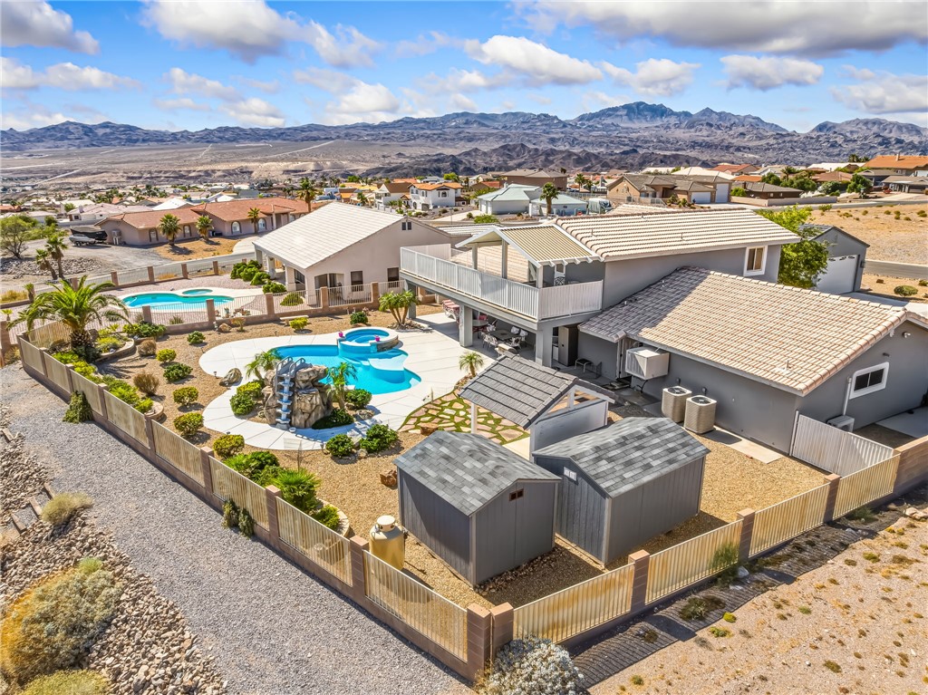 3342 Park Ridge Avenue Bullhead City, AZ 86429 - Photo 86 of 93 The property features a large outdoor area with two swimming pools, a spa, and a rock waterfall