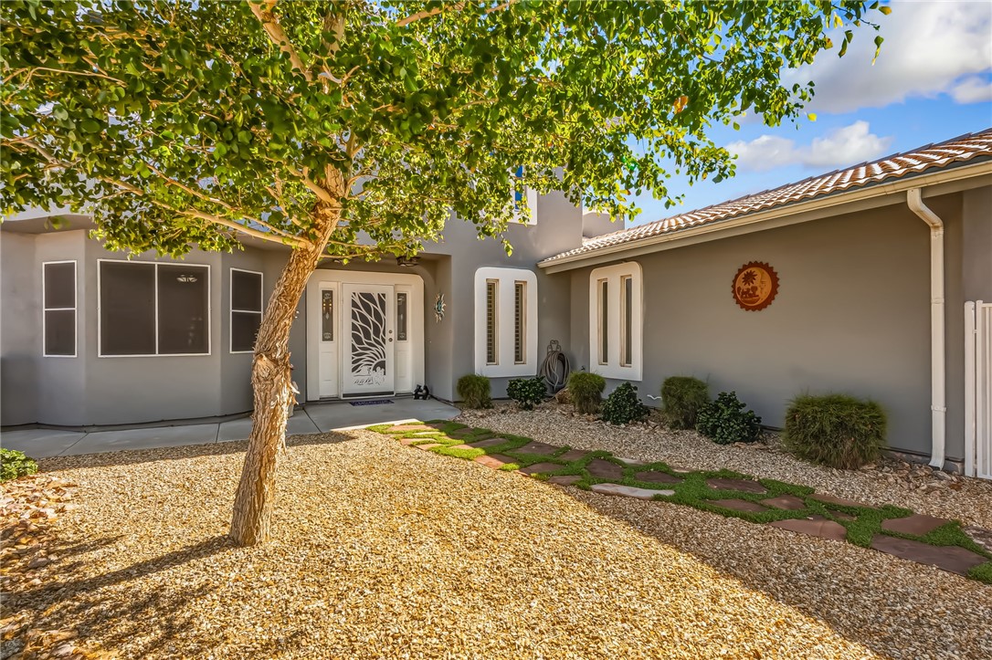 3342 Park Ridge Avenue Bullhead City, AZ 86429 - Photo 10 of 93 The property features a stucco exterior, a decorative front door, and a tiled roof