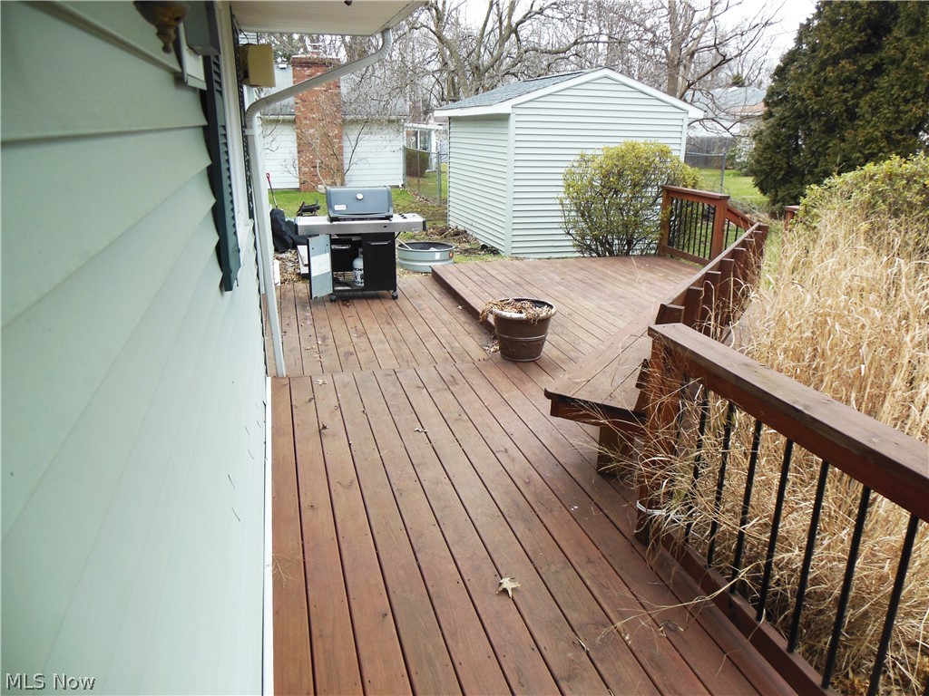 1709 Meadows Road Madison, OH 44057 - Photo 17 of 25 Back deck is roomy & has built-in bench.