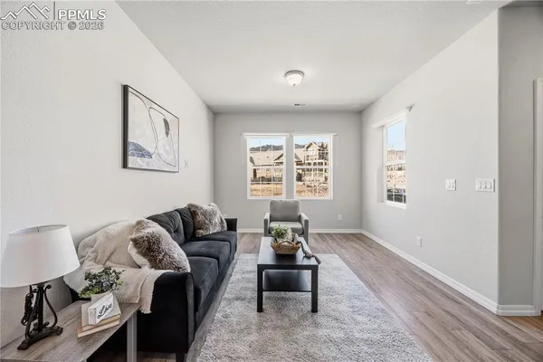 a living room with furniture and a window