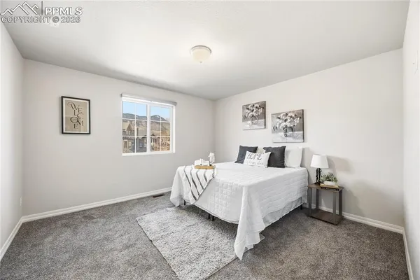 a room with a bed and a window