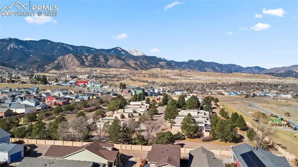 an aerial view of residential house and sandy dunes