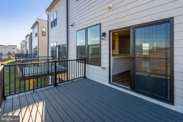 a view of a balcony with wooden floor