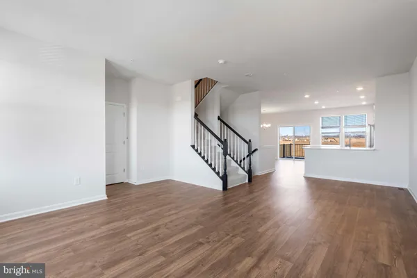 a view of an entryway with wooden floor