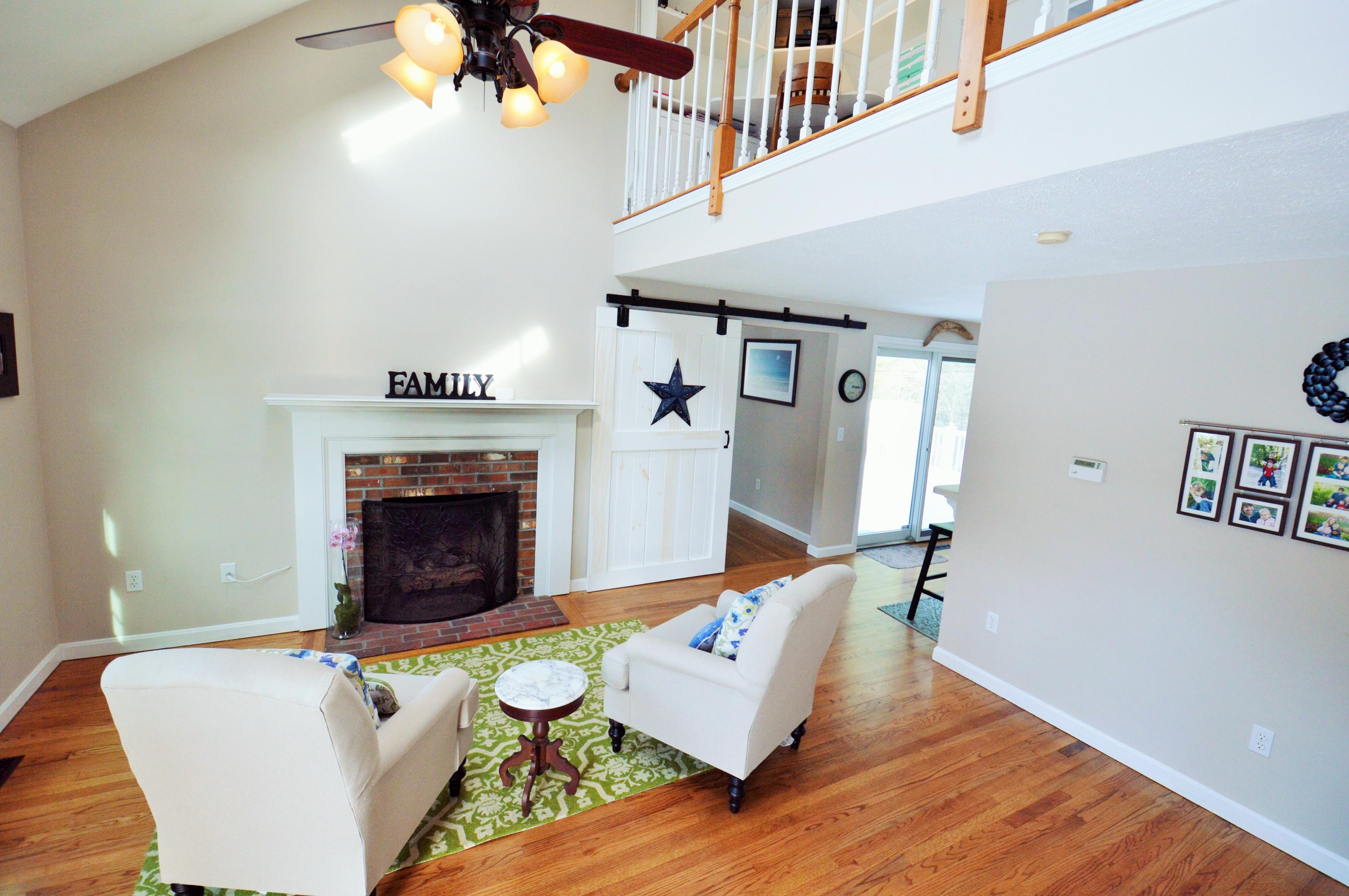 24 Braley Jenkins Road Centerville, MA 02632 - Photo 4 of 20 a living room with furniture and a fireplace