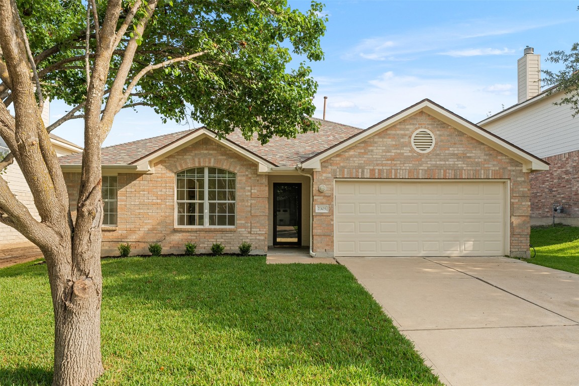 2305 Boulder Run Georgetown, TX 78626 - Photo 1 of 1 a front view of a house with a yard and garage