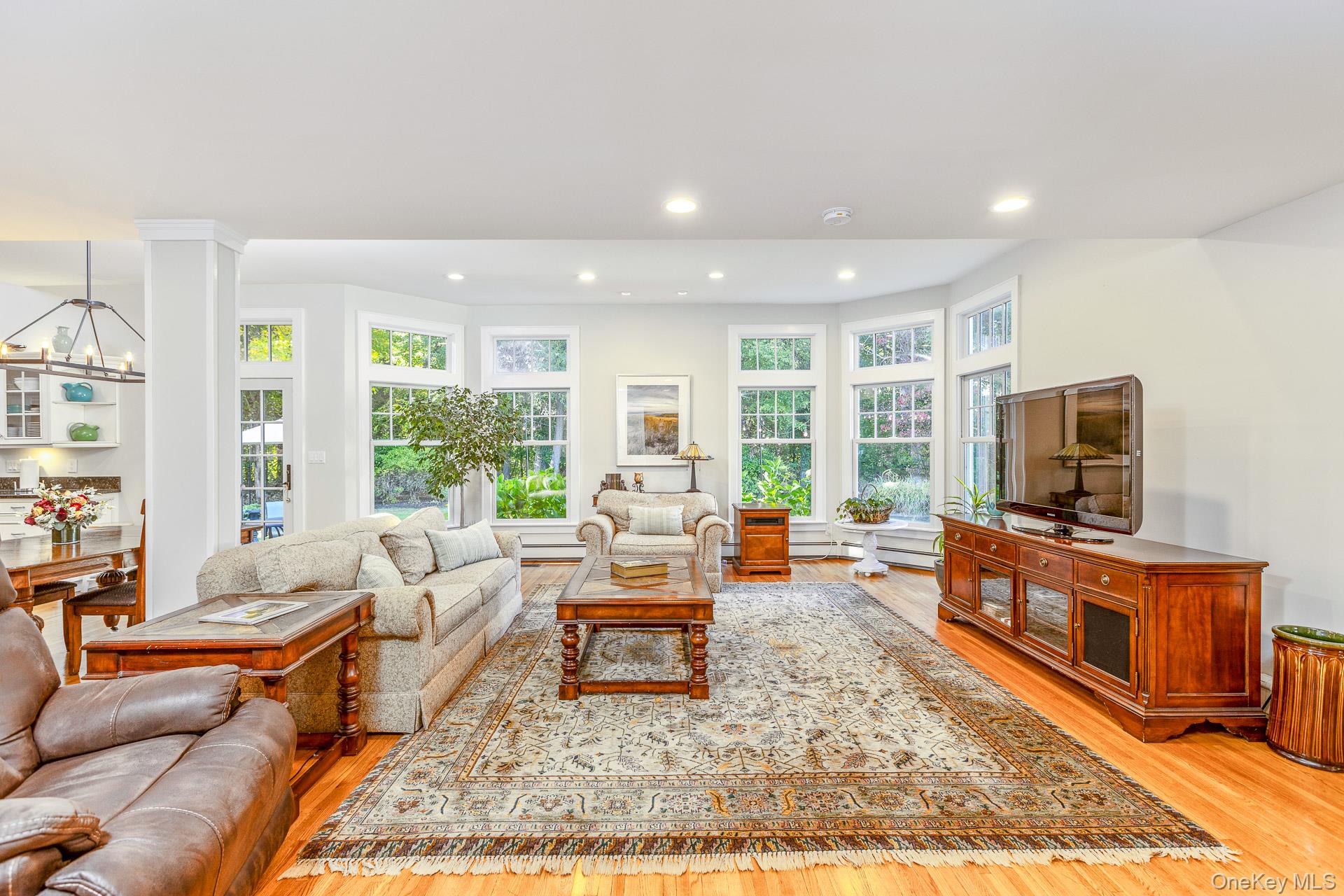 7 Shipyard Lane Setauket, NY 11733 - Photo 12 of 32 a living room with furniture and a flat screen tv