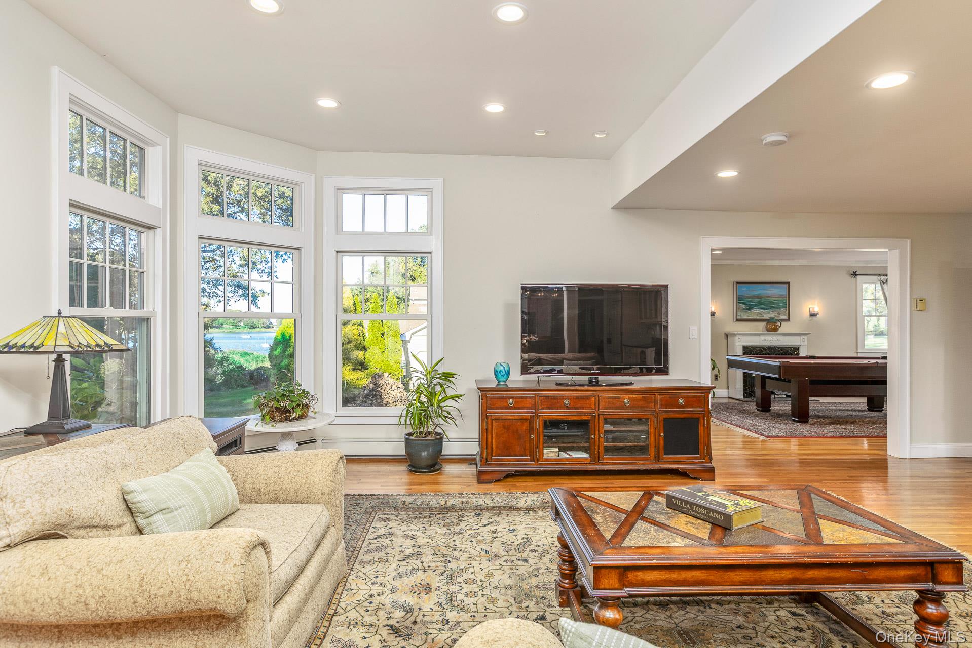 7 Shipyard Lane Setauket, NY 11733 - Photo 13 of 32 a living room with furniture and a flat screen tv