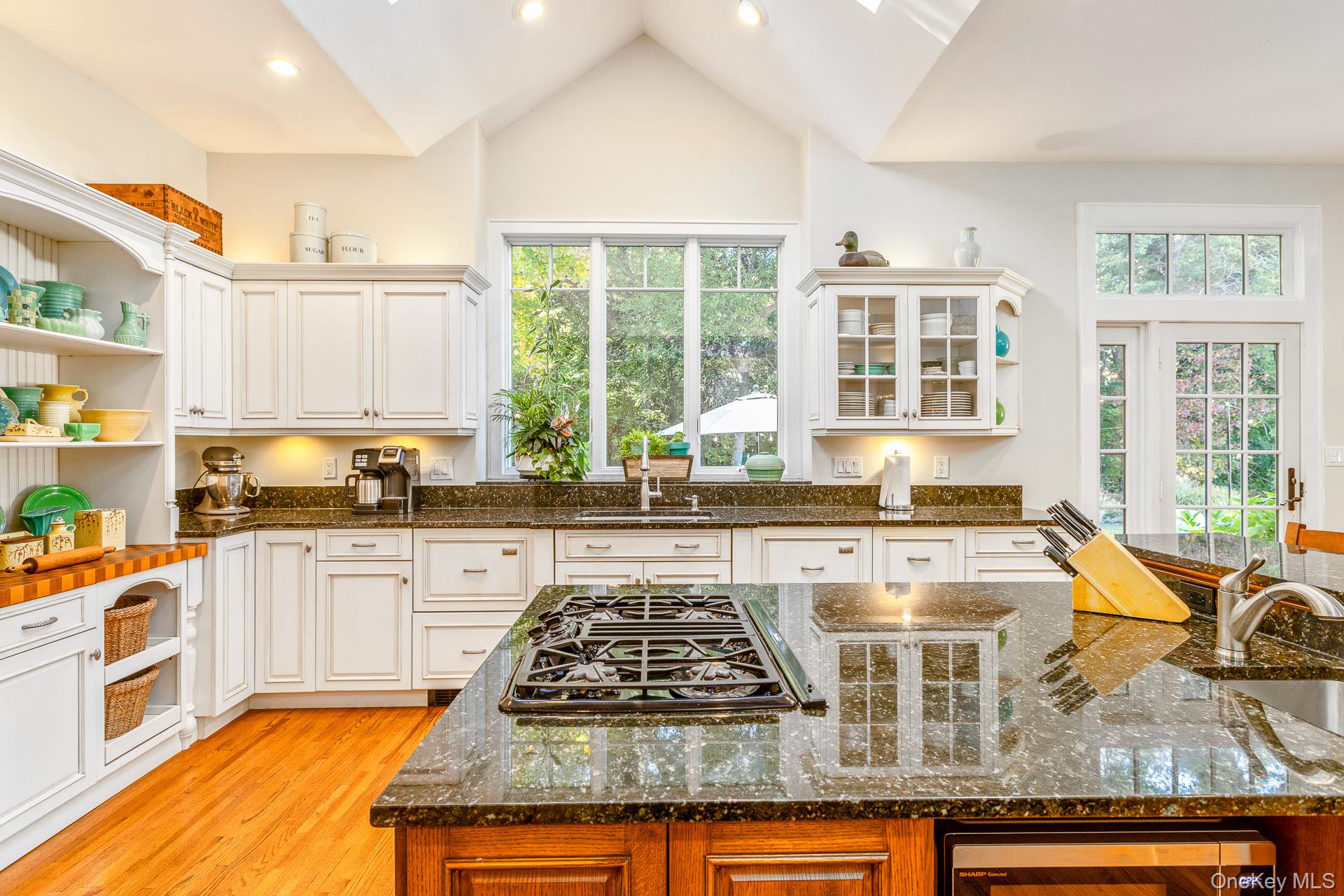7 Shipyard Lane Setauket, NY 11733 - Photo 18 of 32 a kitchen with a stove a sink a refrigerator and window