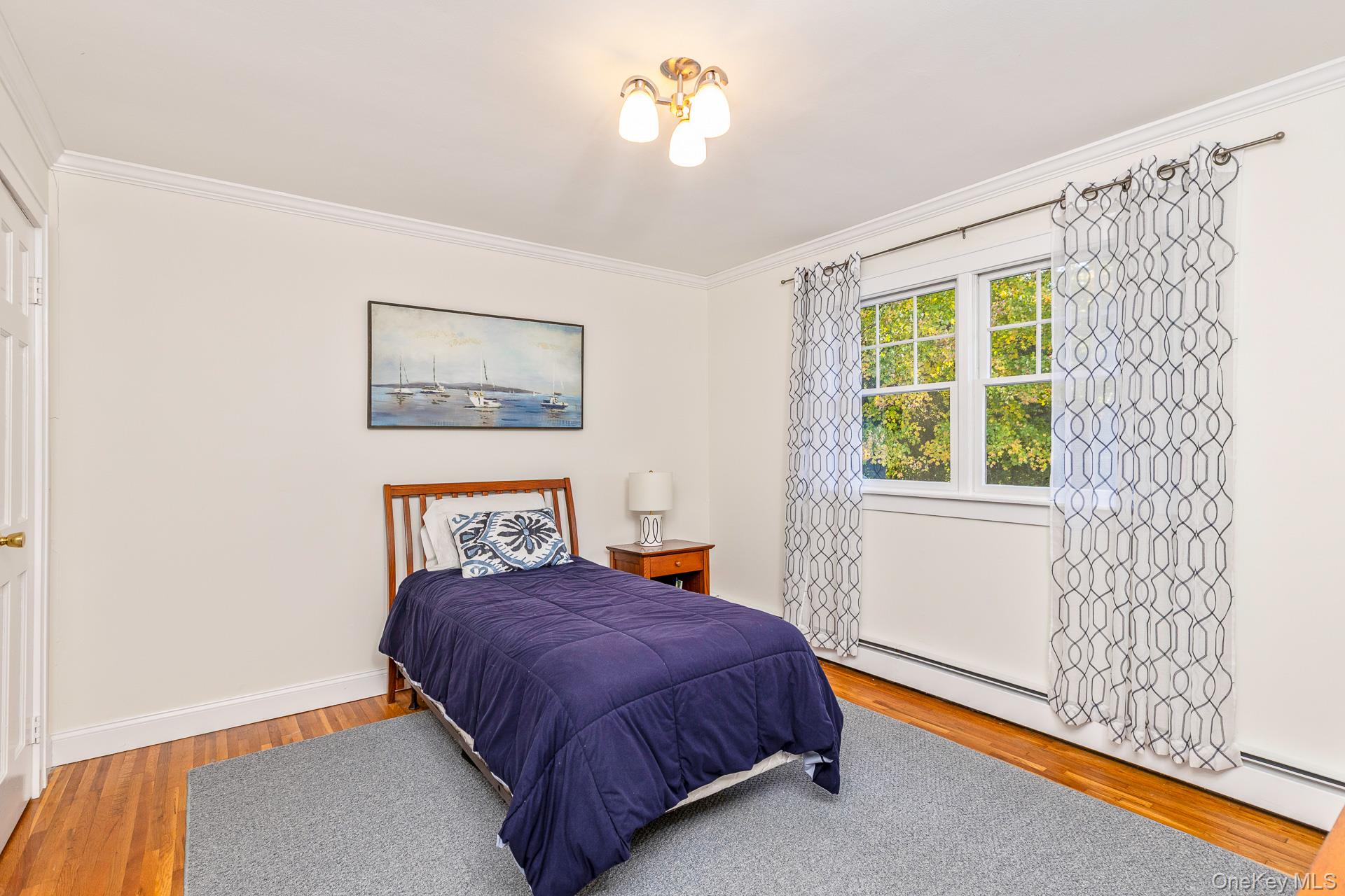 7 Shipyard Lane Setauket, NY 11733 - Photo 23 of 32 a bedroom with a bed and a window