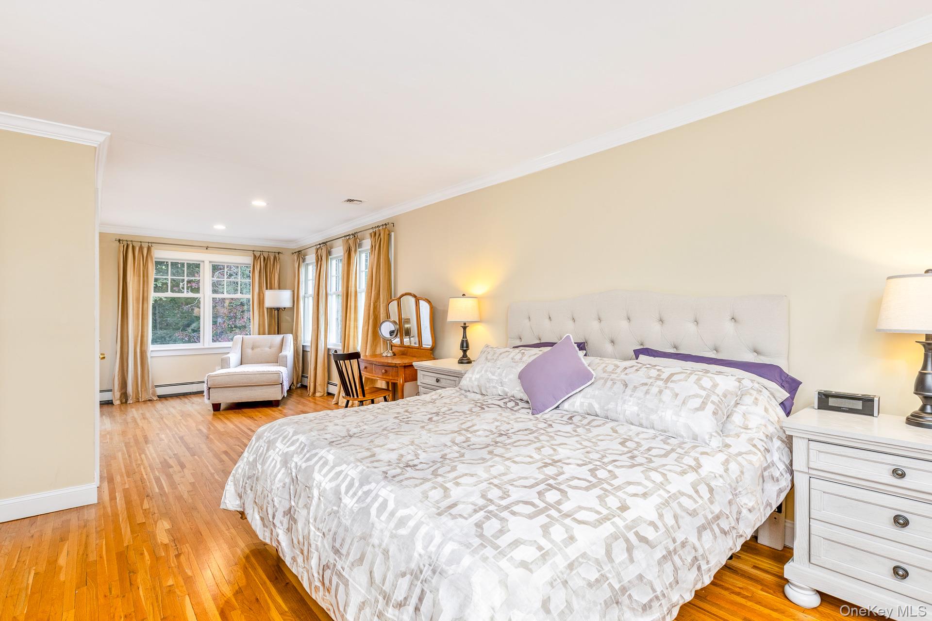 7 Shipyard Lane Setauket, NY 11733 - Photo 25 of 32 a bedroom with a bed and wooden floor