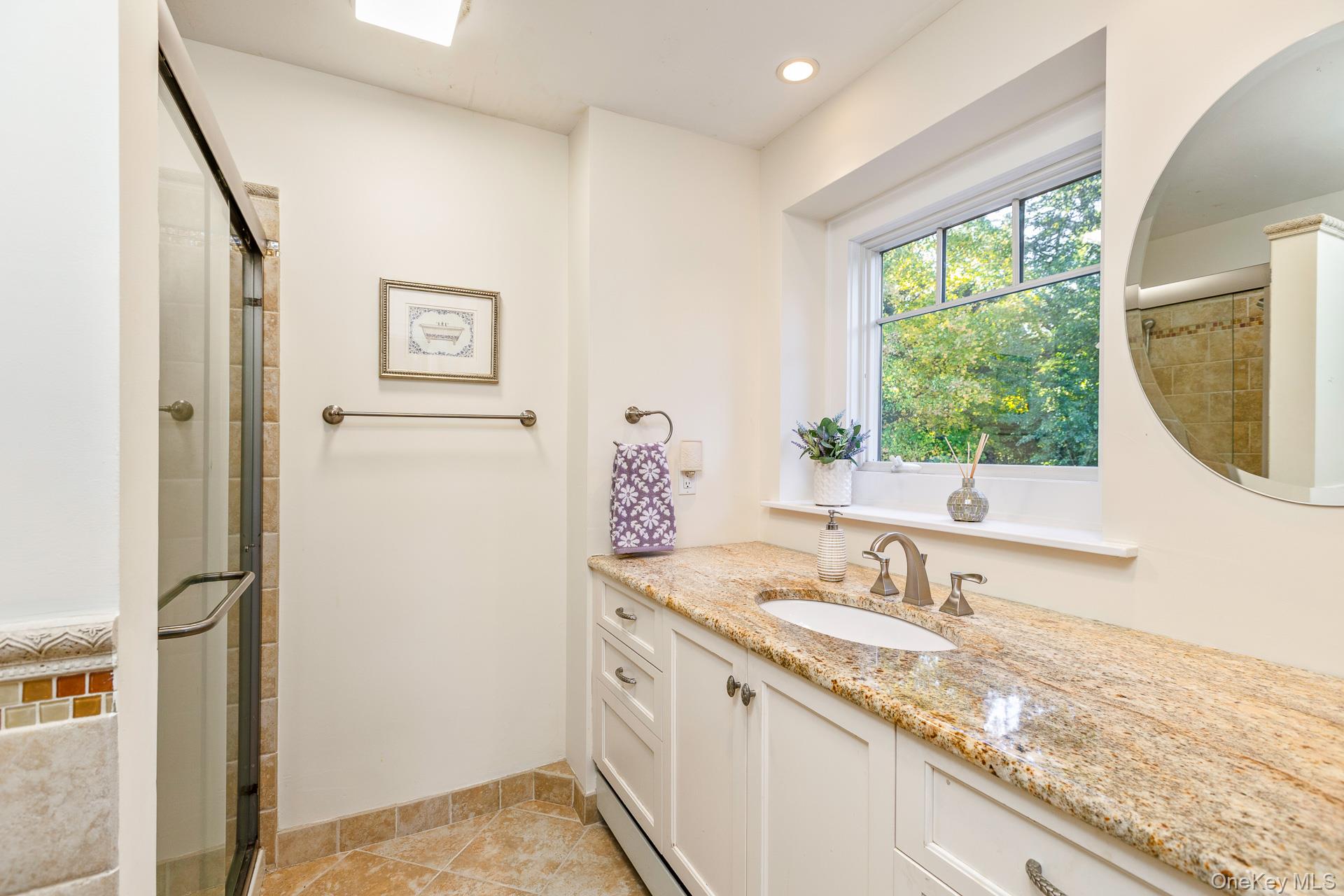 7 Shipyard Lane Setauket, NY 11733 - Photo 27 of 32 a bathroom with a granite countertop sink and a mirror