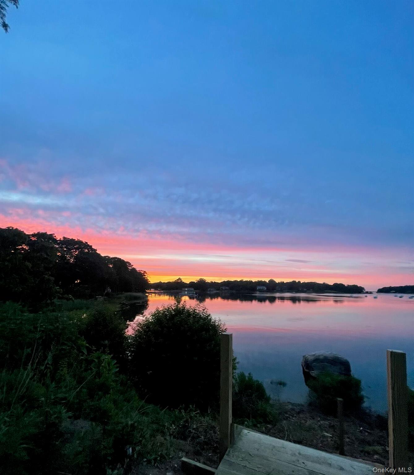 7 Shipyard Lane Setauket, NY 11733 - Photo 3 of 32 a view of lake with mountain view