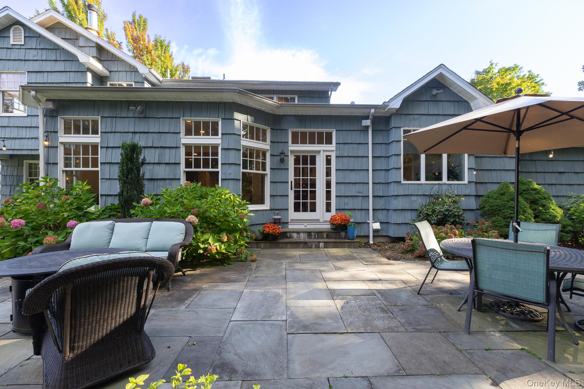 7 Shipyard Lane Setauket, NY 11733 - Photo 31 of 32 a backyard of a house with seating space