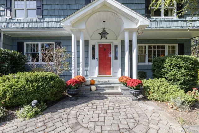 a view of entryway with wooden floor and door