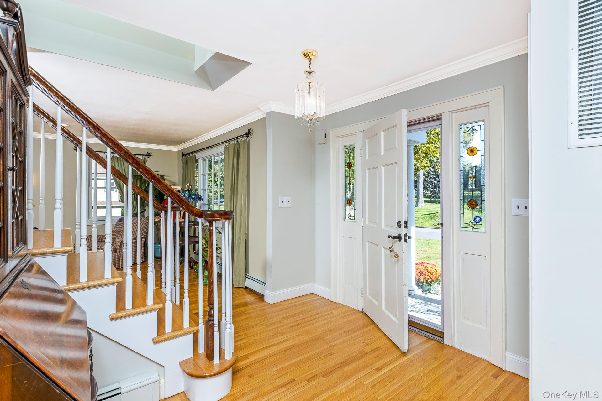 7 Shipyard Lane Setauket, NY 11733 - Photo 6 of 32 a view of entryway with wooden floor and door