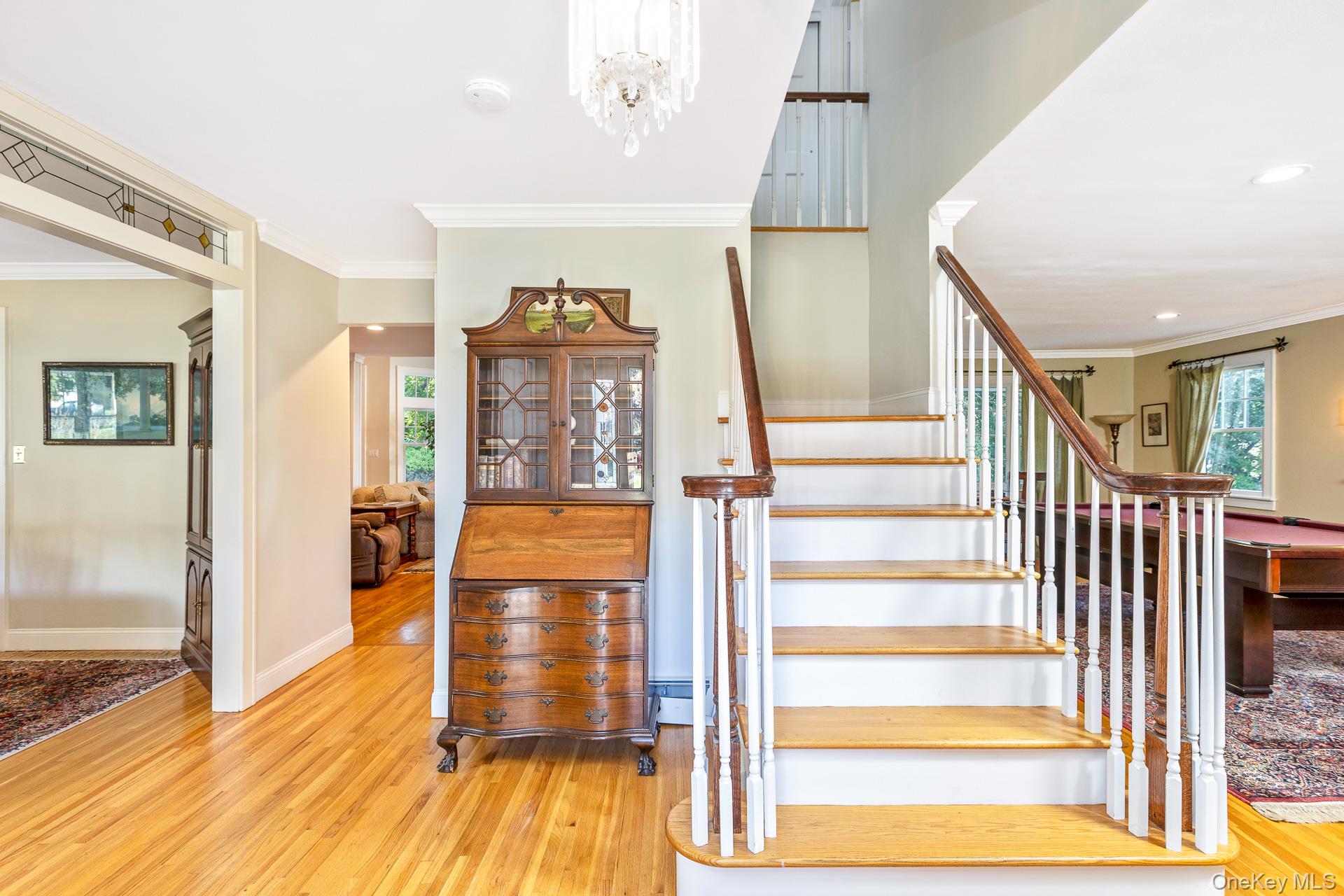 7 Shipyard Lane Setauket, NY 11733 - Photo 7 of 32 a view of entryway with wooden floor and livingroom view